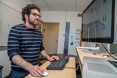 Dev Millstein works in front of his computer.