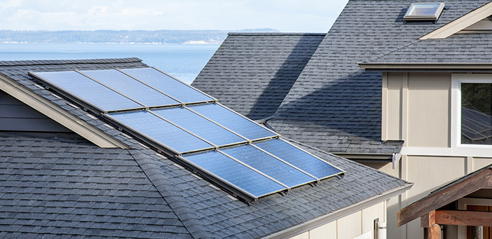Solar panels on a residential roof to provide supplemental electricity.